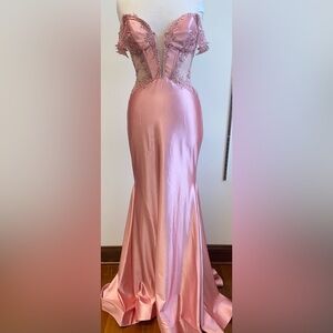 Sherri Hill. 56998. Fitted off the shoulder gown with sheer bodice.